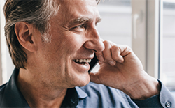 close up of man speaking on cell phone