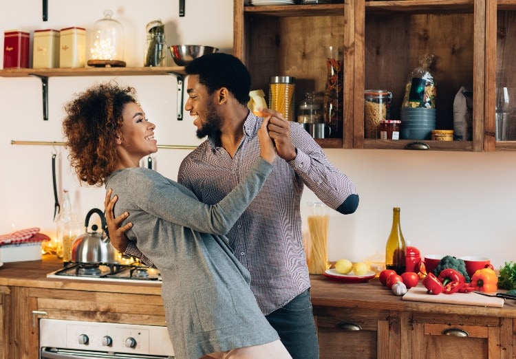 Couple dancing in kitchen