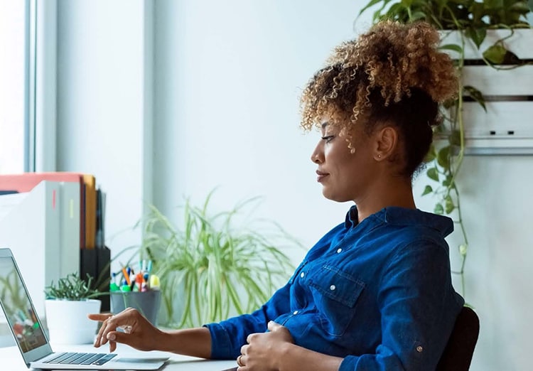 woman works on laptop