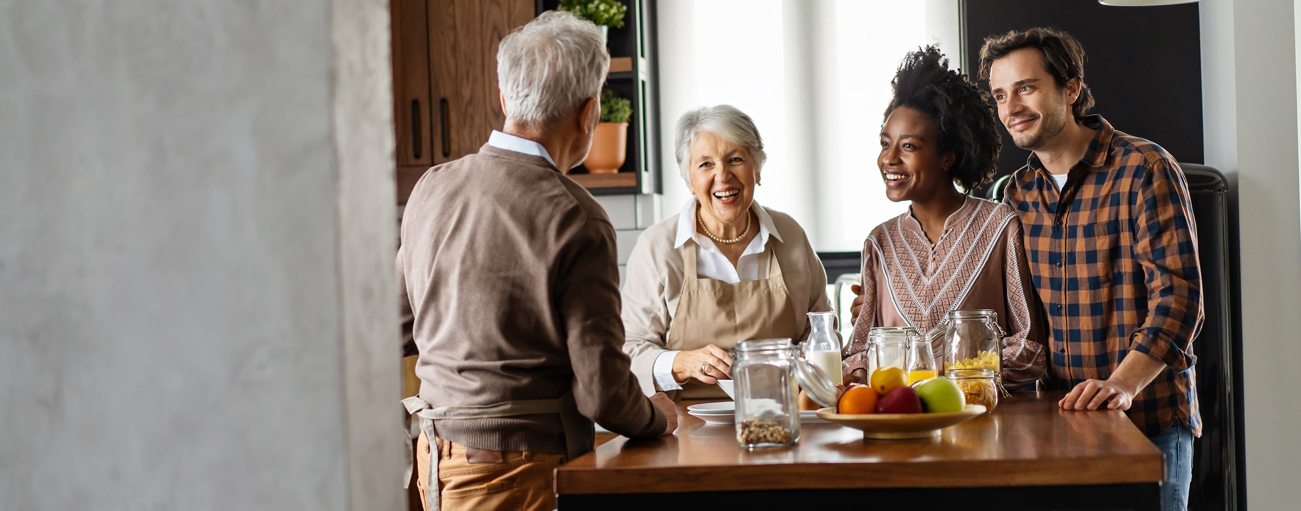 Family gathers around kitchen counter