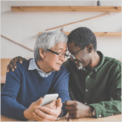 multiethnic senior men embracing while spending time together