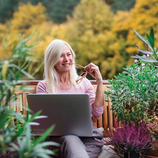 Image of older woman with laptop.