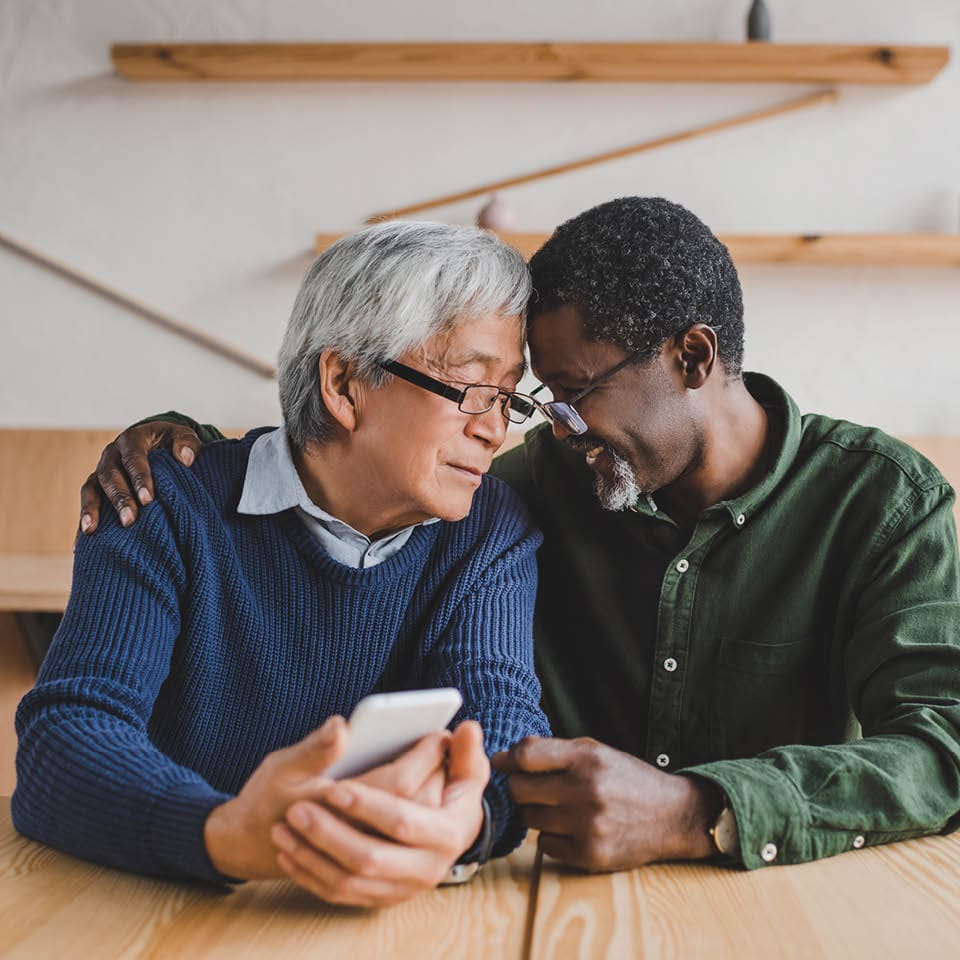 Image of older couple embracing.