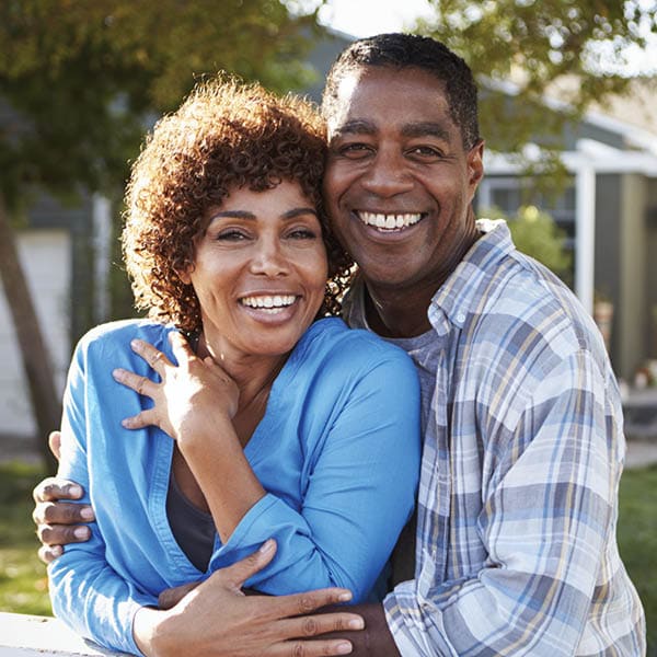 Older, happy couple, embracing.