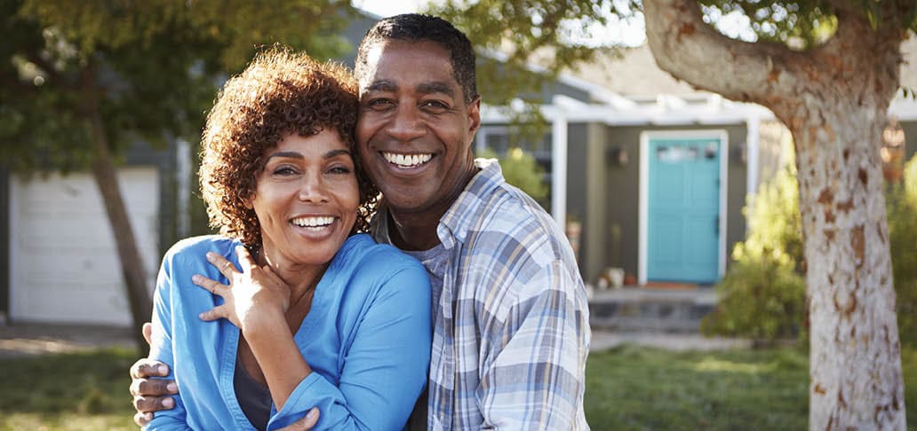 Image of older, happy couple, embracing.