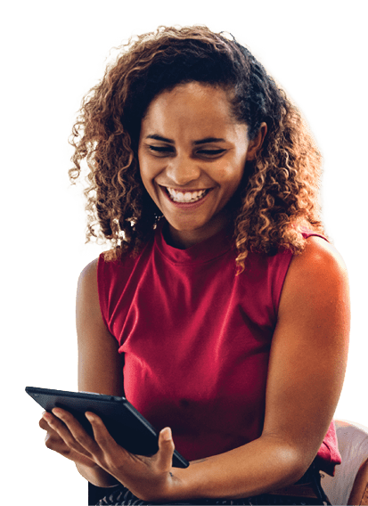 Portrait of cheerful black skin african woman smiling and using tablet for video conversation while relaxing on desk in modern office. Concept of young business people working at home.